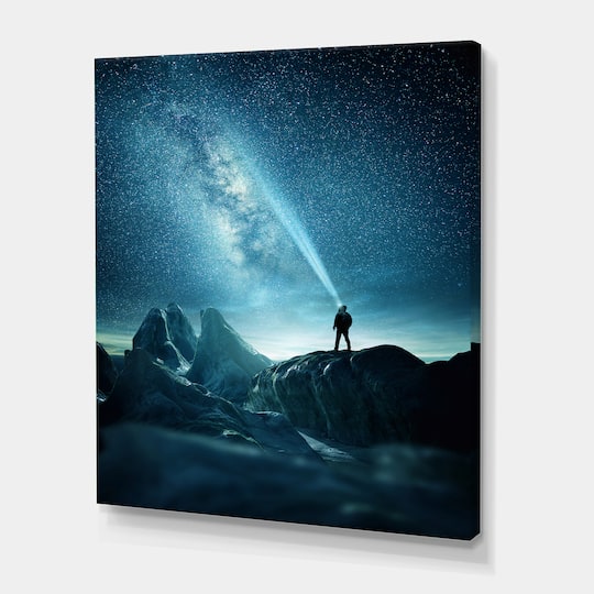Designart - A Man Shining A Light Into The Night Sky - Modern Canvas Wall Art Print